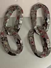 Aretes en cadenas