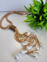 # 123- Collar de perlas